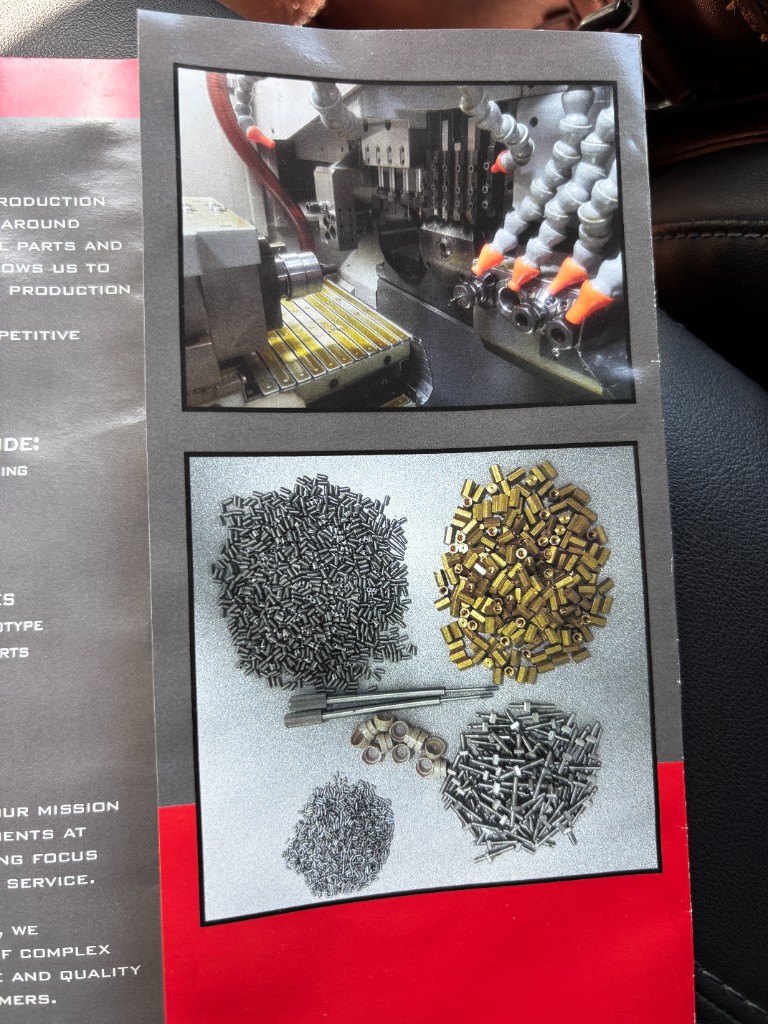Swiss CNC lathe machine with coolant nozzles in precision operation