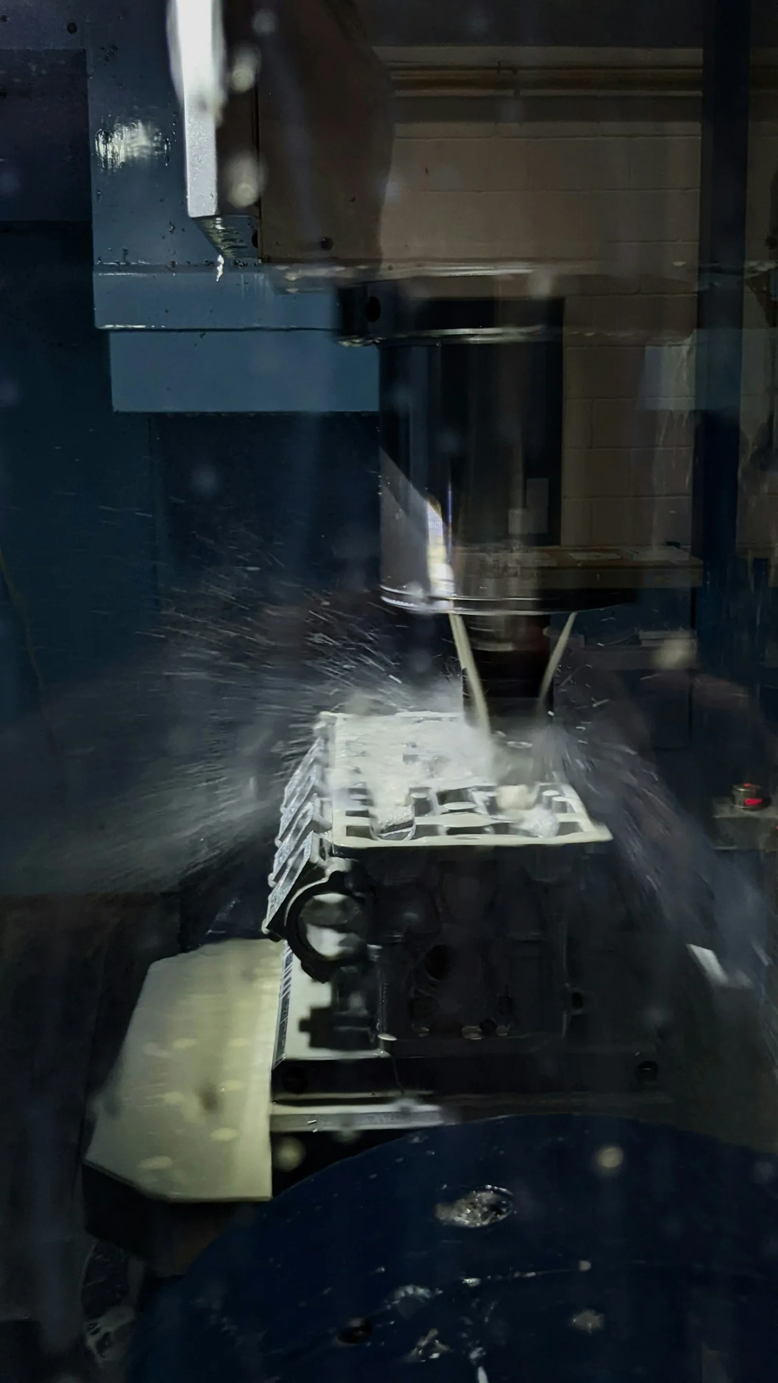 CNC milling machine cutting complex metal geometry